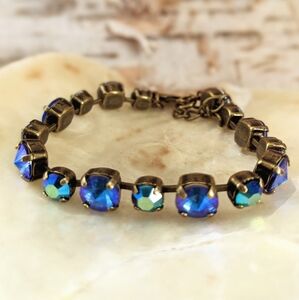 Swarovski Crystal Mettalic Blue Tennis Classic Bracelet In Brass